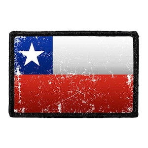 May include: A rectangular patch featuring the flag of Chile with a distressed, weathered texture. The design includes a blue square with a single white star on the left, a white horizontal stripe on the top right, and a red horizontal stripe on the bottom right, all bordered by a thick black stitched edge.