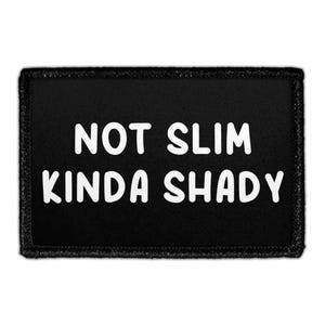 May include: Black rectangular patch with the white text "NOT SLIM KINDA SHADY". The patch has a black border and is likely an iron-on or sew-on patch for clothing or accessories.