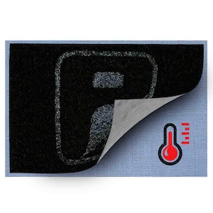 May include: A black rectangular patch with a peeled corner, revealing a gray backing. The patch features a white outline of a letter "P" and a red thermometer icon with temperature bars. The background is light blue.