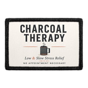 May include: A rectangular patch with a black border and off-white background. It features the text CHARCOAL THERAPY, an illustration of a charcoal chimney starter, and the text Low & Slow Stress Relief and NO APPOINTMENT NECESSARY.