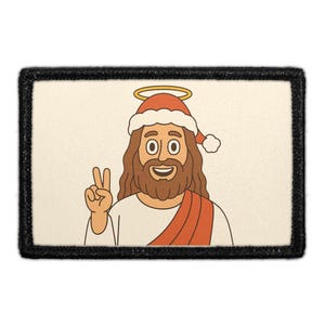 May include: Rectangular patch featuring a cartoon illustration of a smiling figure with long brown hair and a beard, wearing a Santa hat and a red sash. The figure is giving a peace sign. The patch has a black border.