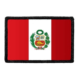 May include: A rectangular patch featuring the national flag of Peru with vertical red and white stripes and the central coat of arms. The emblem displays a vicuña, a cinchona tree, and a cornucopia overflowing with gold coins, all bordered by a black edge.