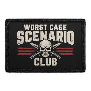 May include: A rectangular black patch featuring the white text WORST CASE SCENARIO CLUB. In the center, a white human skull is positioned over two crossed knives. Three horizontal red lines are visible behind the skull and knife design.