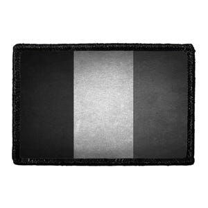 May include: A rectangular patch featuring a vertical tricolor design with a black left panel, a central light gray panel, and a dark gray right panel. The entire piece is framed by a thick, textured black border with stitched edges.