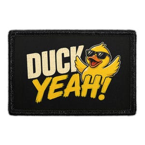 May include: A rectangular black patch featuring a yellow cartoon duck wearing black sunglasses. The duck has its wings raised and is positioned next to the text DUCK YEAH! in bold, distressed yellow and white lettering against the black background.
