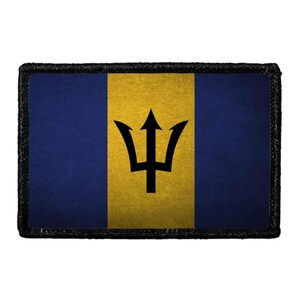 May include: A rectangular patch featuring the flag of Barbados with a vertical triband design of two dark blue outer bands and a central gold band. A black trident head is centered on the gold band, and the entire patch has a black border.