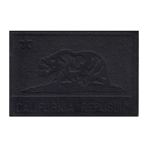 May include: A black rectangular patch featuring the embossed image of a bear, a star, and the words "CALIFORNIA REPUBLIC". The patch has a textured surface and a dark, monochromatic color scheme.