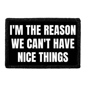 May include: Black rectangular patch with the white text: "I'M THE REASON WE CAN'T HAVE NICE THINGS." The patch has a black border and is likely made of fabric. The text is in a bold, sans-serif font.