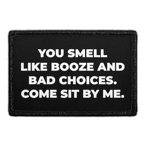 May include: Black rectangular patch with white text that reads: "YOU SMELL LIKE BOOZE AND BAD CHOICES. COME SIT BY ME."