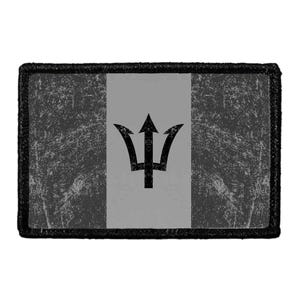 May include: A rectangular patch featuring a distressed gray and black tricolor design. The center panel is a solid light gray, while the two side panels have a textured, weathered black finish. A black trident emblem is centered on the patch.