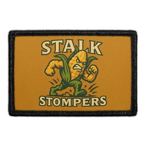 May include: A rectangular patch with a black border and a tan background. The patch features a cartoon corn character with an angry expression, running forward. The text "STALK STOMPERS" is above and below the corn character.
