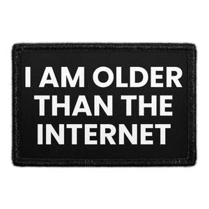 May include: Black rectangular patch with the white text "I AM OLDER THAN THE INTERNET". The patch has a black border with stitched detailing. The text is in a bold, sans-serif font.