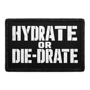 May include: A rectangular black patch with a stitched border featuring the white distressed text HYDRATE OR DIE-DRATE in a bold, blocky font. The design is centered on the fabric surface, creating a high-contrast look with a weathered appearance.