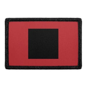 May include: A rectangular patch featuring a solid red background with a centered black square. The entire design is framed by a thick, black stitched border, creating a clean and bold geometric aesthetic suitable for various textile applications.