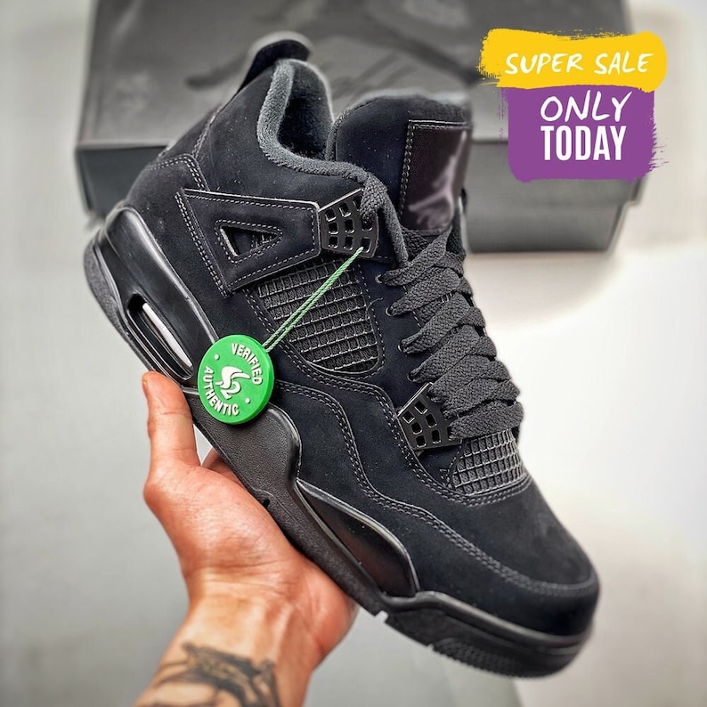 aj4 black cat on feet