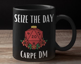 May include: Black coffee mug with white text that reads "Seize the Day Carpe DM". A red twenty-sided die with a gold crown is in the center of the mug.