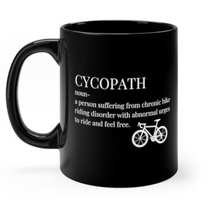 以下が含まれることがあります： 白いデザインで「CYCOPATH」と書かれた黒いコーヒーカップ。これは、「慢性的な自転車に乗る障害で、異常な衝動で乗り、自由を感じたいという人」と定義されています。デザインには、自転車の白いシルエットも含まれています。