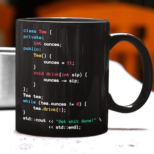 May include: Black coffee mug featuring a humorous coding design. The code reads "class Tea { private: int ounces; public: Tea() { ounces = 11; } void drink(int sip) { ounces -= sip; }; } Tea tea; while (tea.ounces != 0) { tea.drink(1); } std::cout << "Get shit done!" << std::endl;"
