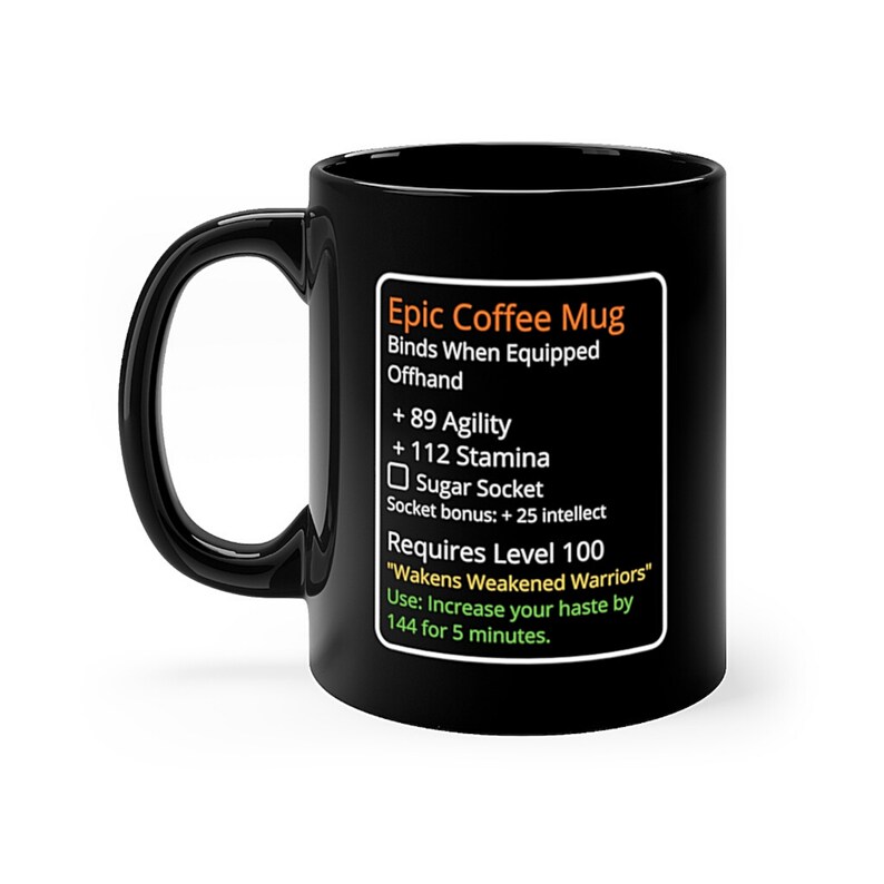 May include: Black coffee mug with a white design that looks like a video game item description. The text reads "Epic Coffee Mug", "Binds When Equipped Offhand", "+ 89 Agility", "+ 112 Stamina", "Sugar Socket", "Socket bonus: + 25 intellect", "Requires Level 100", "Wakens Weakened Warriors", "Use: Increase your haste by 144 for 5 minutes."
