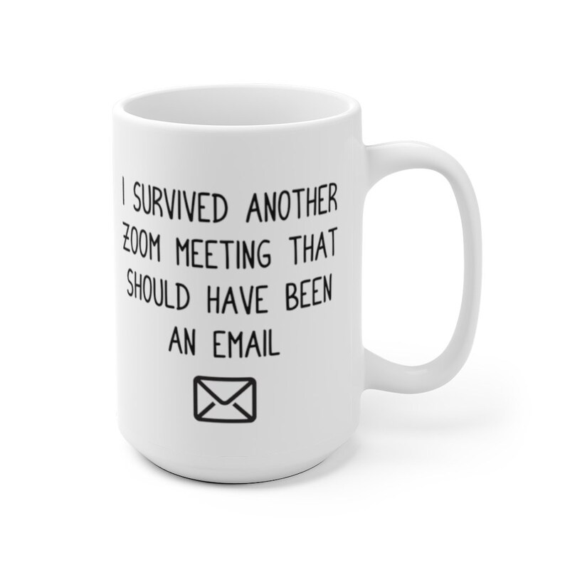 May include: White ceramic coffee mug with black text that reads "I survived another zoom meeting that should have been an email" and an envelope icon.