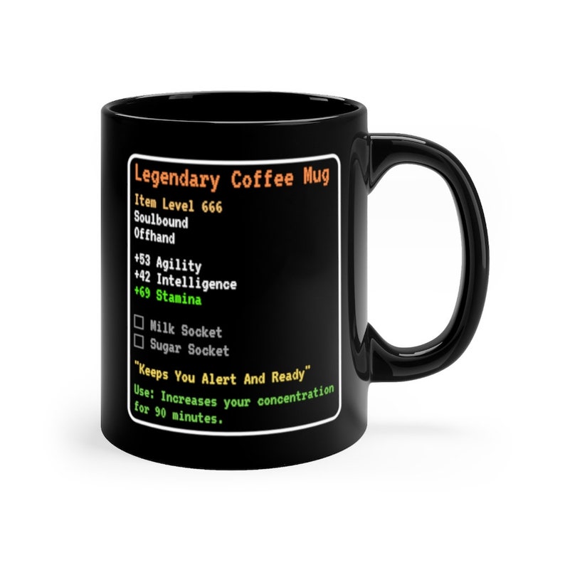 May include: Black coffee mug with a white graphic that looks like a video game character stats screen. The text reads "Legendary Coffee Mug", "Item Level 666", "Soulbound", "Offhand", "+53 Agility", "+42 Intelligence", "+69 Stamina", "Milk Socket", "Sugar Socket", "Keeps You Alert And Ready", "Use: Increases your concentration for 90 minutes."