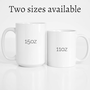 May include: Two white ceramic mugs, one 15 oz and one 11 oz, side by side on a white surface.
