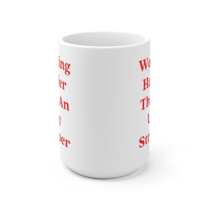 May include: White ceramic mug with red text that reads "Working harder than my superpower" on the left side and "Work hard, have fun, then repeat" on the right side.