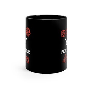 May include: Black ceramic mug with white text that reads "You're not a real gamer until you've rolled a natural 20."  The text is surrounded by red dice symbols.