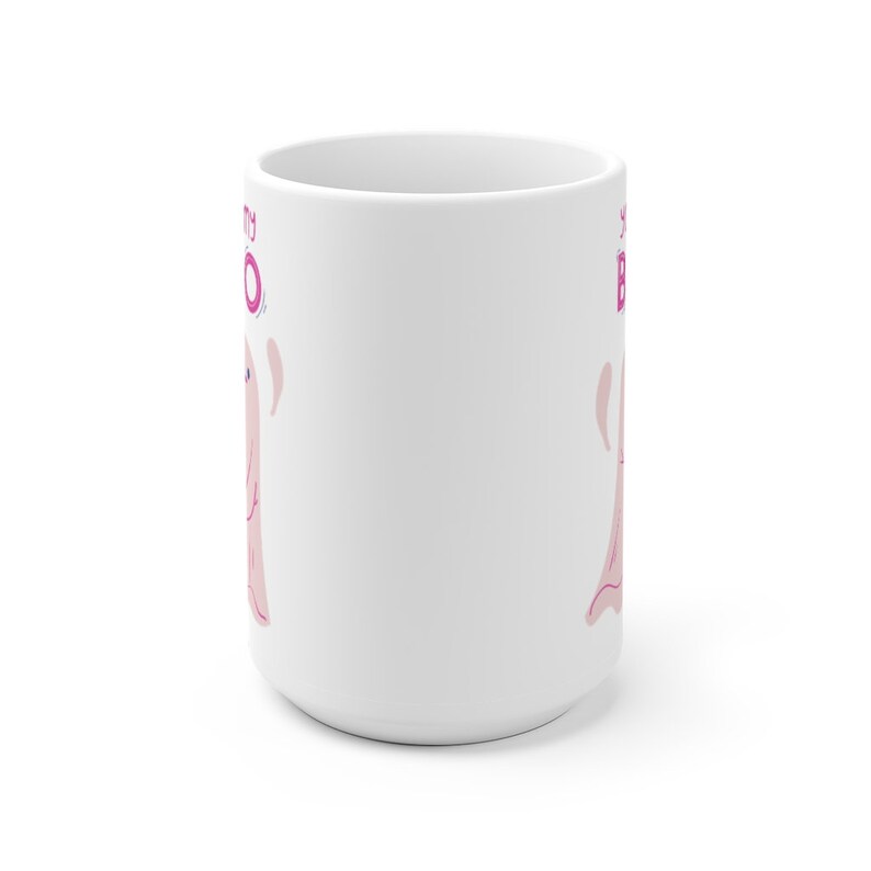 May include: White ceramic mug with a pink ghost illustration and the text "Boo-tiful" in pink and purple lettering.