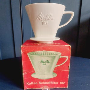 Melitta porcelain filter 102 with spoon in original box embossed letters three-hole coffee filter