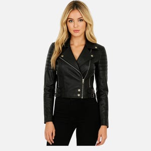 May include: A black leather jacket with a classic biker style. The jacket features a notched collar, an asymmetrical zipper closure, and silver hardware. The shoulders have quilted detailing, and the waist has adjustable buckles. The jacket is a sleek, stylish outerwear piece.