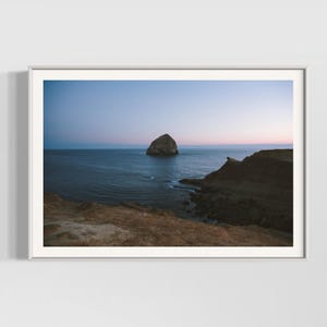 Minimalist Ocean Print | Coastal Wall Art | Nature Photography

Escape into the serene beauty of Cape Kiwanda, Oregon, where rugged cliffs meet the deep blue sea under a pastel sky. This calming, minimalist print is perfect for bringing a sense of peace and natural beauty to any space. A unique piece for ocean lovers and those drawn to the vastness of nature. Explore more coastal landscape prints in my shop and bring the tranquility of the sea into your home.