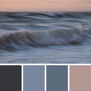 May include: A photograph of a wave crashing on the beach at sunset. The water is a light blue color, and the sky is a soft pink. The wave is breaking into a white crest, and the water is moving in a blurred motion.