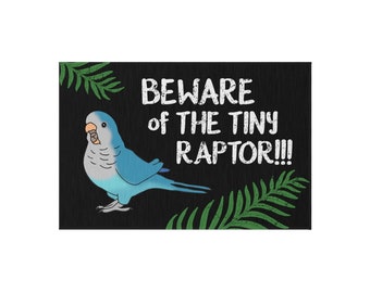May include: A black and green doormat with a blue and gray parrot and the text "BEWARE of the TINY RAPTOR!!!"