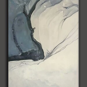 May include: Abstract painting with swirling blue and white paint. The painting has a dark blue and black area on the left side and a white area on the right side. The two areas are separated by a thin line of black paint.