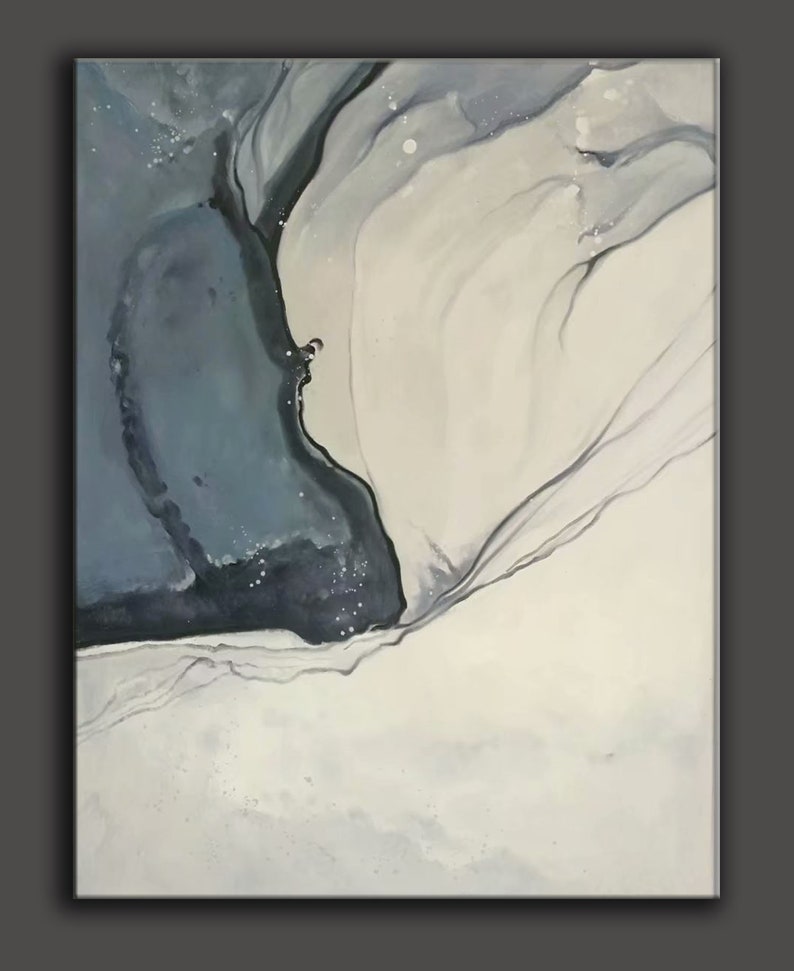 May include: Abstract painting with swirling blue and white paint. The painting has a dark blue and black area on the left side and a white area on the right side. The two areas are separated by a thin line of black paint.