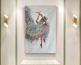 May include: A colorful abstract painting of a ballerina in a white dress with a colorful, swirling skirt. The painting is on a white canvas with a gold frame and is hanging on a white wall.