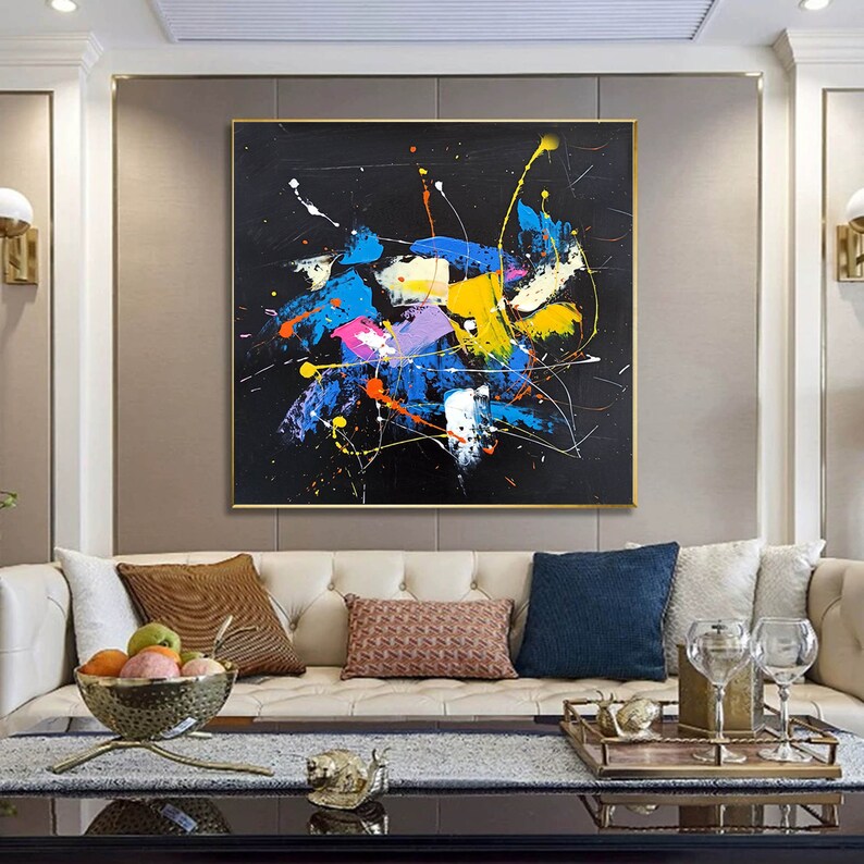 May include: Abstract painting with splashes of blue, yellow, pink, orange, and white paint on a black background.