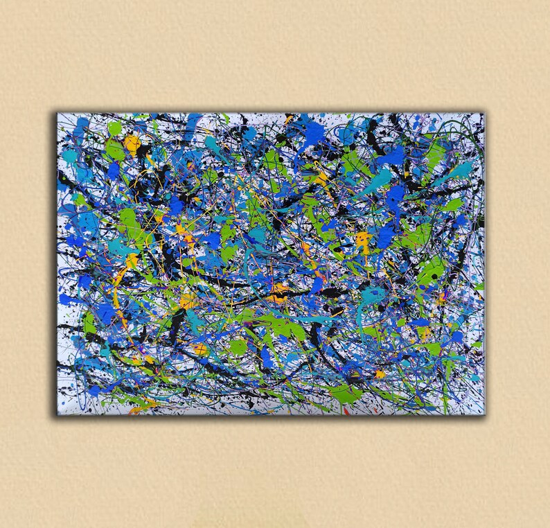 May include: Abstract painting with a white background and splashes of blue, green, yellow, and black paint.