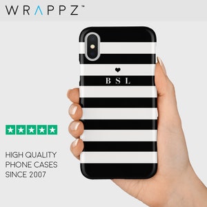 May include: Black and white striped phone case with a small heart and the letters "BSL" in white.