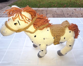 Pippi's crocheted horse, grey with black spots and reddish mane, with saddle and bridle, approx. 32 cm long x 32 cm high