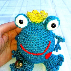 Crocheted frog, frog prince in love with gold ball