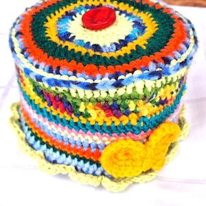 Toilet paper hats crocheted colorful from yarn scraps