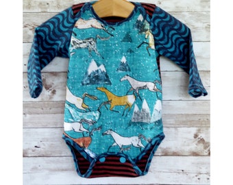 baby clothes with horses on them