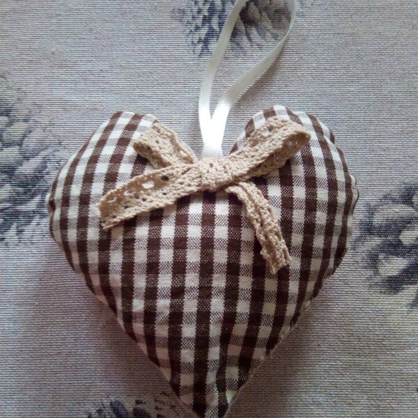 A brown gingham heart door cushion