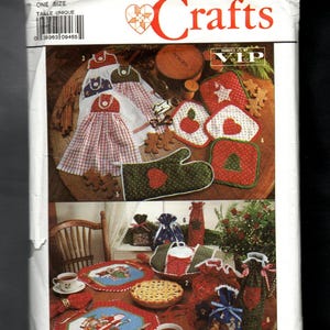 May include: A Simplicity Crafts sewing pattern envelope 0608 for kitchen accessories. The front shows illustrations of hanging towels, pot holders, oven mitts, placemats, and fabric gift bags with holiday-themed red, green, and blue patterns.