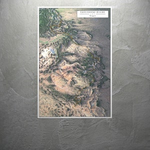 May include: A map of the Continental Divide Trail, a 3,100-mile hiking trail that runs from Glacier National Park in Montana to the southern tip of New Mexico. The map shows the trail's route through the Rocky Mountains, as well as major landmarks and points of interest.