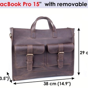 May include: A brown leather laptop bag with two front pockets and a top handle. The bag measures 14.9 inches wide, 11 inches tall, and 3.5 inches deep.