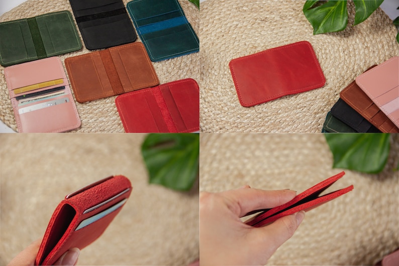 May include: A set of six leather card holders in various colors, including pink, red, brown, green, and black. The card holders are laid out on a woven surface and a hand is holding one of the red card holders open.
