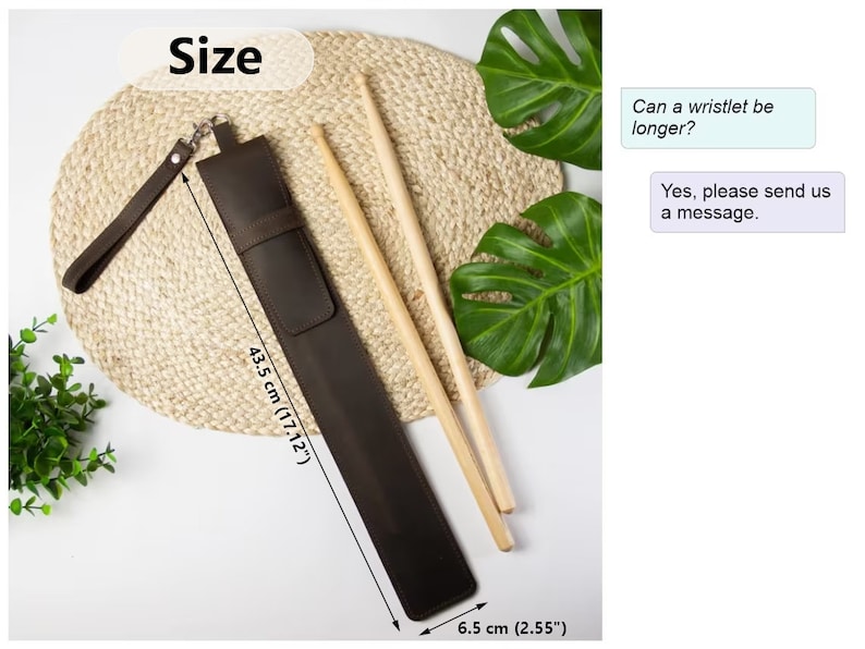May include: Brown leather drumstick holder with a wrist strap. The holder measures 43.5 cm long and 6.5 cm wide. The text "Size" is written in white on a black background. The text "Can a wristlet be longer?" and "Yes, please send us a message." are written in white on a light blue background.
